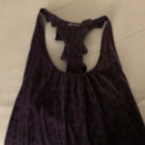 dressy tank top that poofs out a bit on bottom and has round neck ,cross down ?